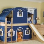A bunk bed with extras is used as a playhouse and a good place to sleep.
