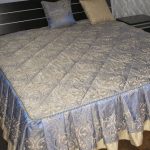 Blue quilted bedspread on double bed