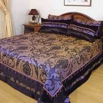 Beautiful purple bedspread and pillows with unusual patterns