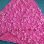 Soft pink plaid with pompoms for girl