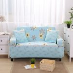 Small blue couch with floral pattern