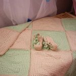 Delicate green and pink knitted knitted plaid