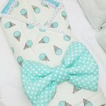 Delicate blanket with a turquoise bow on the statement