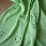 Delicate green blanket with hearts