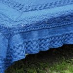 Plaid bed cover in blue