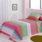 Multicolored striped bedspread in the bedroom