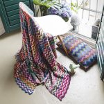 Multicolored blanket and cushion of yarn residues