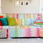 Homemade patchwork bedspread on the sofa