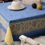 Blue-yellow tablecloth with a square table ornament