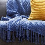 Blue blanket with handmade patterns