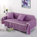 Lilac cover on the sofa will be a bright accent in the interior