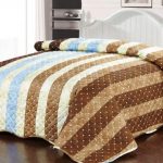 Quilted striped bedspread added unusual monochrome interior