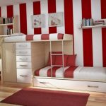 Bright bunk bed in a room with contrasting walls