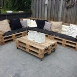 Corner sofa of pallet with mattresses and pillows