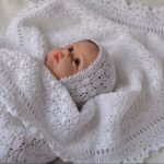 Knitted plaid made of natural cotton for a newborn
