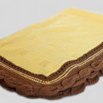 The tan blanket with petals will warm your baby in autumn