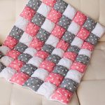 White-pink-gray bonbon blanket with asterisks for baby
