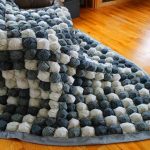 Large white and gray bonbon blanket for a large bed or sofa