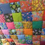 A large patchwork blanket looks unusual.