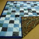 Double-sided blanket in patchwork technique of jeans and fabric remnants