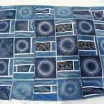 Denim patchwork bedspread with ornaments and embroidery