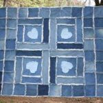 Denim blanket with hearts in the technique of patchwork