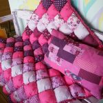 Beautiful soft pink bedspread for outdoor bench