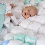 A light and airy blanket using the bonbon technique will fit in the baby’s crib