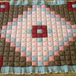 Soft quilt with rhombus in the center