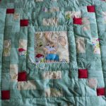 Gentle blanket for the baby in the technique of patchwork