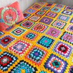 Blanket cover with a yellow background and multi-colored squares