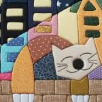 Koc z kotem w technice patchworku