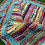 Plaid of multicolored crochet stripes