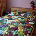 Coverlet of small squares, assembled in the form of crosses