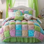 Multi-colored bonbon patchwork quilt with bed pillows