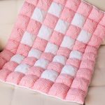 Warm blanket for the newborn girl from the combined materials