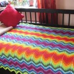 Bright beautiful blanket on the bed