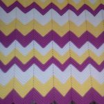 A white-yellow-lilac plaid with a zigzag pattern will decorate your interior.