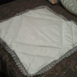 White blanket with ruffles for discharge from the hospital