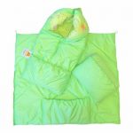 The envelope-blanket of green color with the help of a zipper is transformed into a blanket and envelope