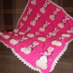 Square pink crochet plaid with Bunny motifs