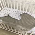 Neutral plush blanket for baby cots