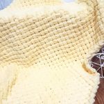 Yellow woven blanket of soft plush
