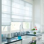 White Roman blinds in the kitchen