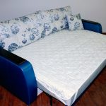 White mattress pad with elastic bands for a sofa bed