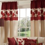 Beige curtains with burgundy pattern on a large window
