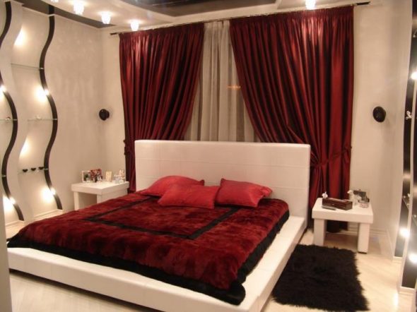 Burgundy curtains and burgundy bedspread