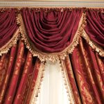 Burgundy curtains with lambrequin tulle pattern and fringe
