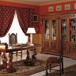 Burgundy curtains with a pattern and grabs for the cabinet