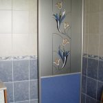 Plastic curtain with a pattern in a modern bathroom